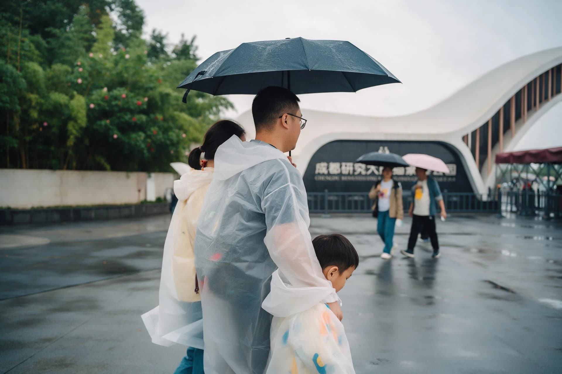 Chengdu best time to visit: a family at the Giant Panda Base South Gate entrance on a misty October morning