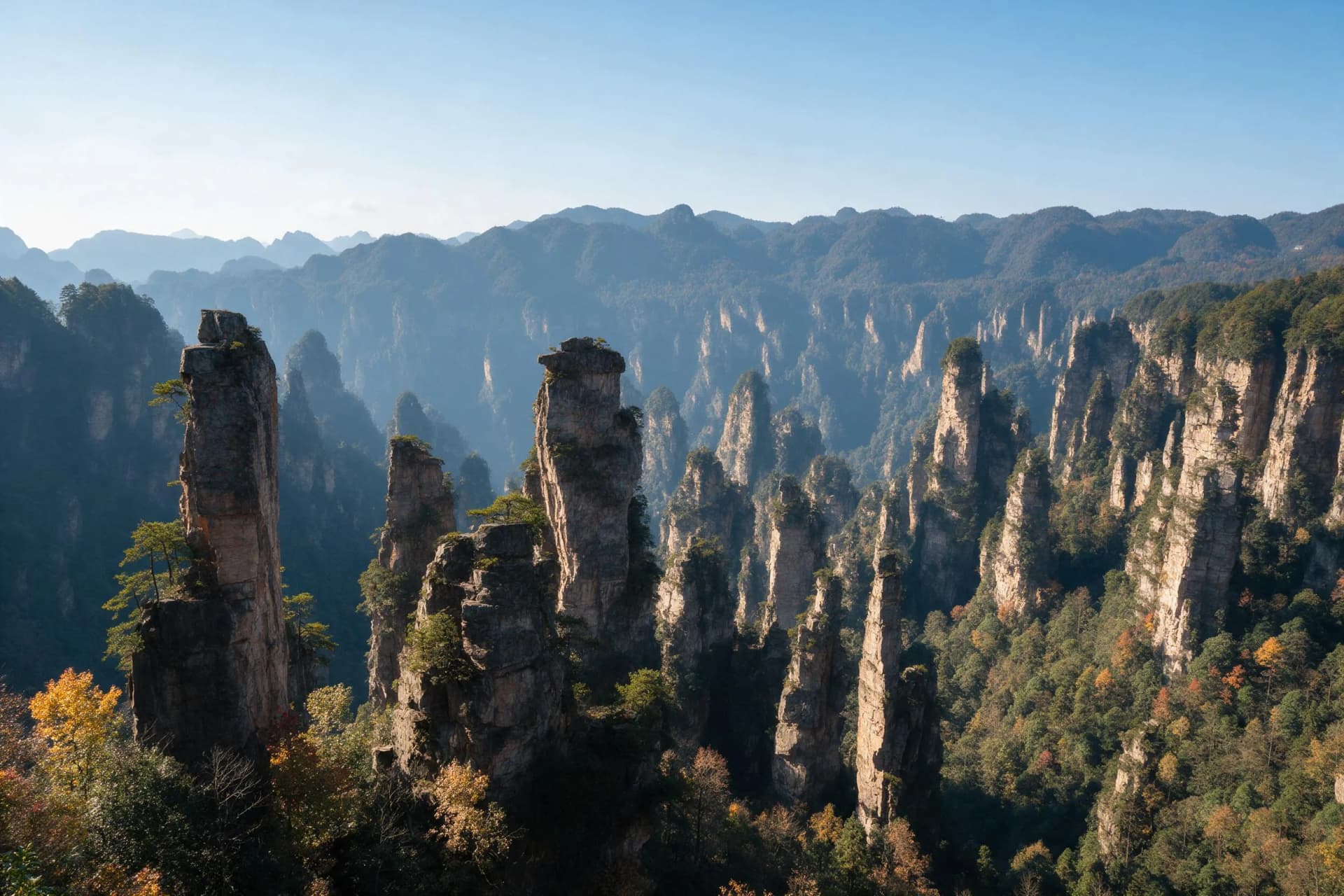 Real travel photograph from the Yuanjiajie platform in Zhangjiajie on a cool late-October morning at 7:20 am, mist below the sandstone pillars, 35mm, f/2.8, 1/250s, ISO 200
