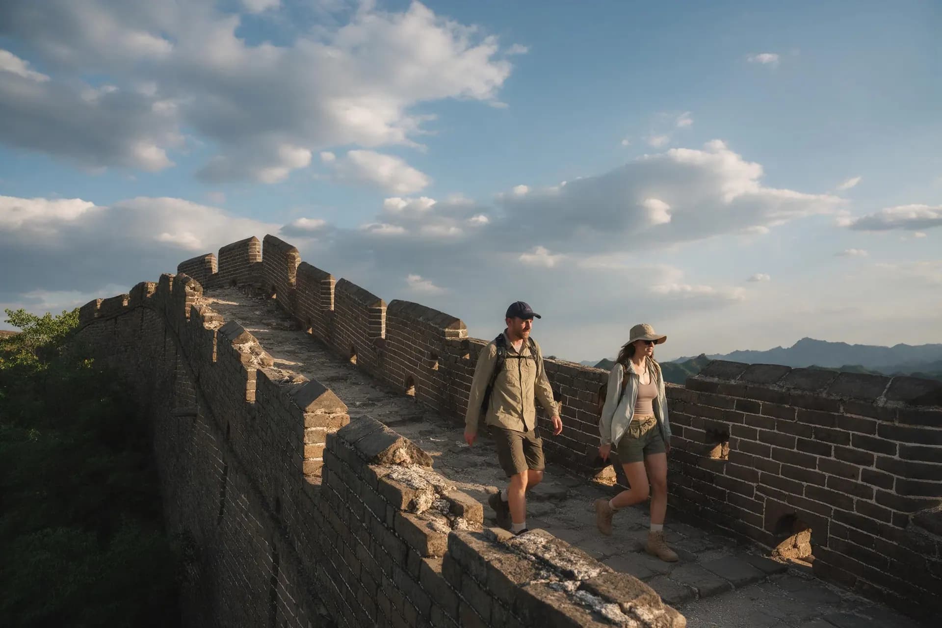 A traveler walking the Great Wall at Jinshanling at sunrise
